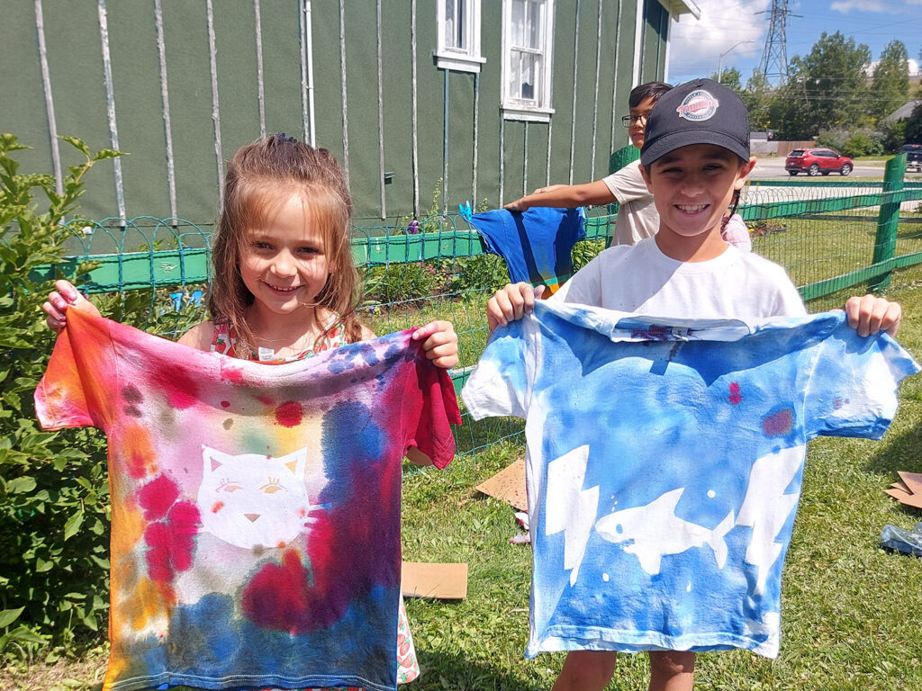 Two children show their Tie-dye shirts